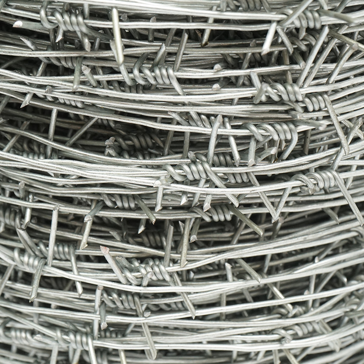 Galvanized barbed wire roll 250m, distance between barbs 11-14cm, for fencing.