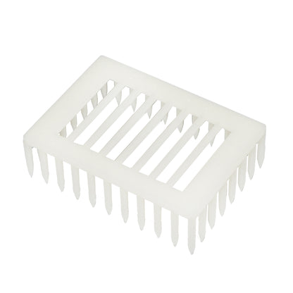 Queen bee isolator on a plastic comb with pins