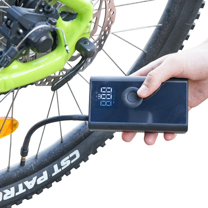 Black portable air compressor 36W with 4000mAh rechargeable battery and accessories