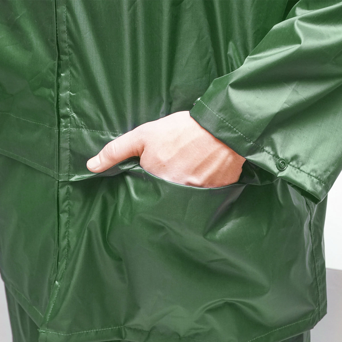 Waterproof suit size L with hood and polyester and PVC pants, green Breckner Germany