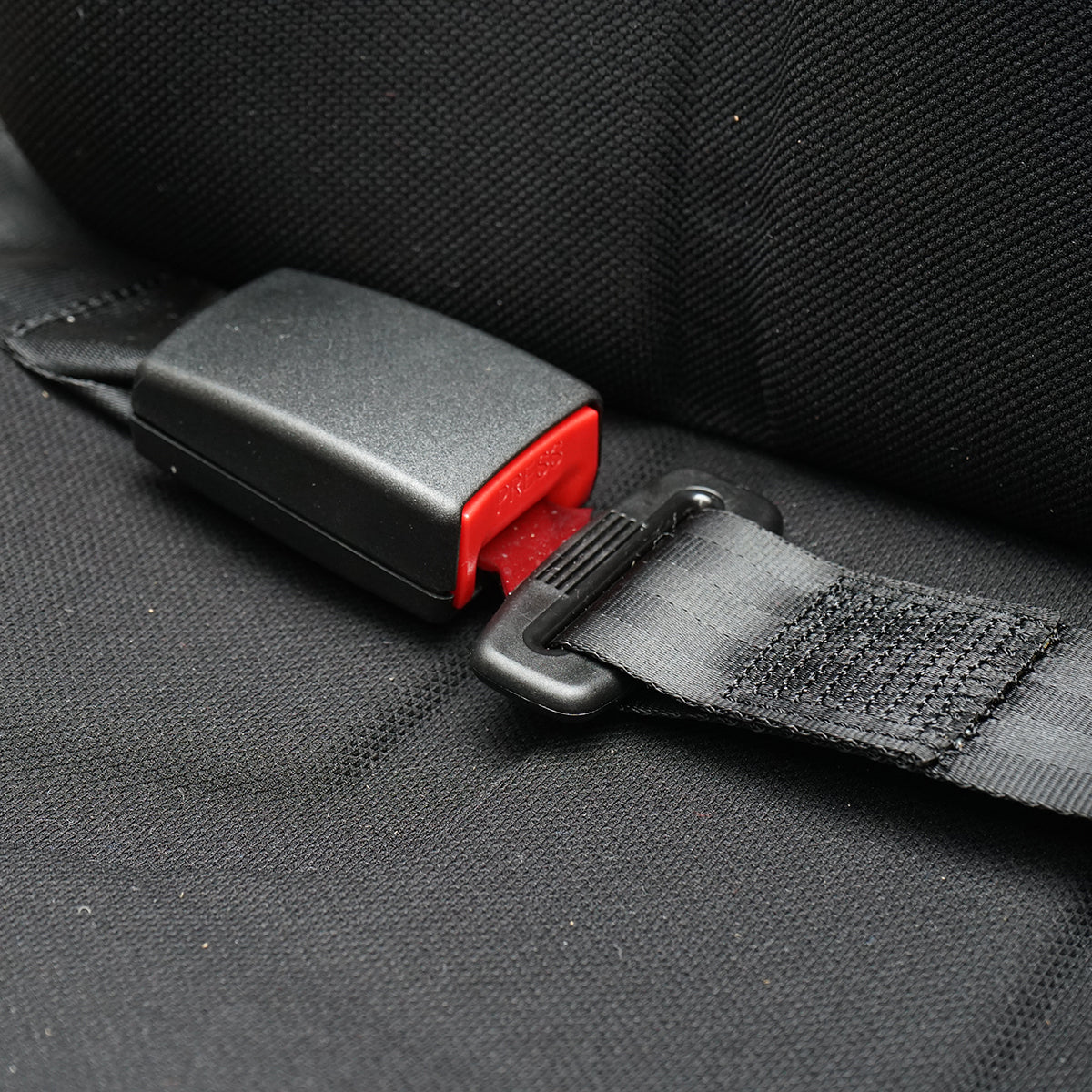 Black adjustable tractor seat with armrest, headrest, seatbelt, and mechanical suspension, seat width 455mm